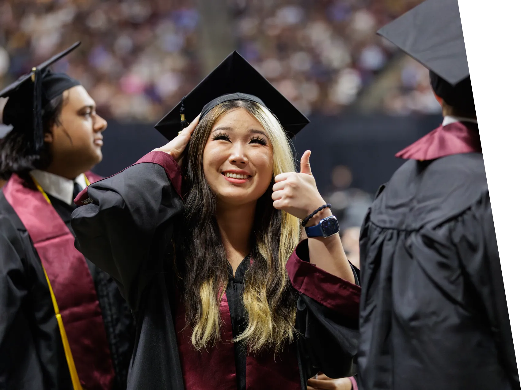 artsci graduation woman smiling with thumbs up