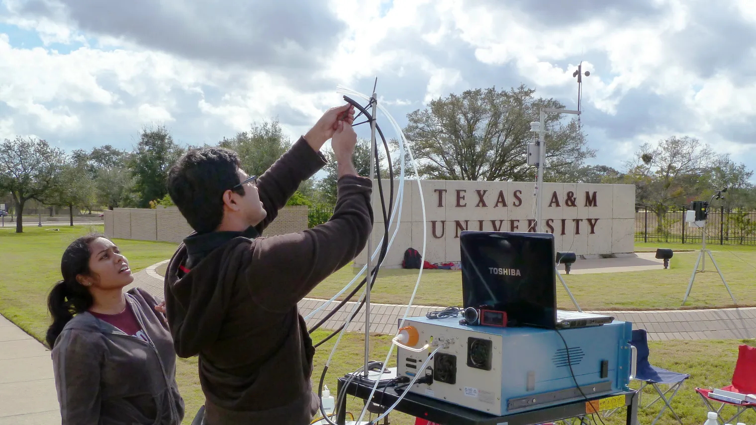 Two Meteorology students doing field research.